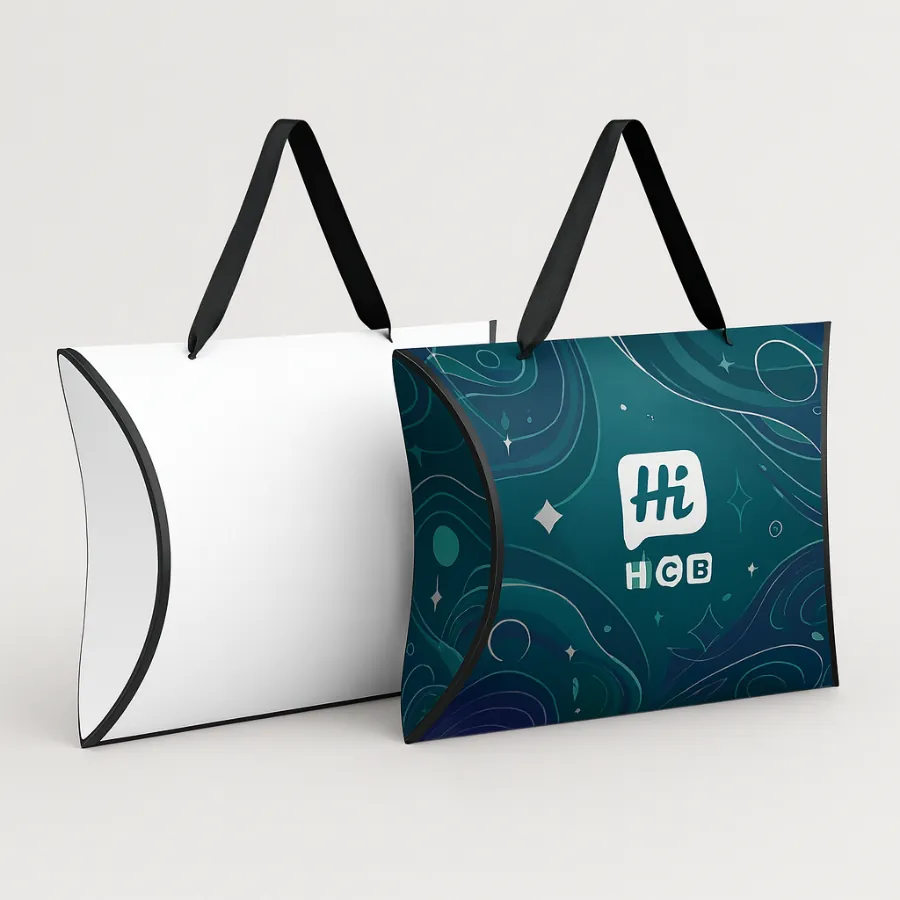 Gift pillow boxes with black ribbon handles- one white and one in dark teal pattern- class=